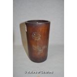 A Chinese bamboo brush pot with incised inscripion and floral decoration, 15cm.