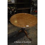 A 19th Century mahogany tripod table with moulded rim, 59.5 x 62.5cm.