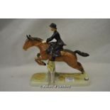 *Beswick figure of a lady riding sidesaddle jumping over a fence, 26cm. (Lot subject to VAT)