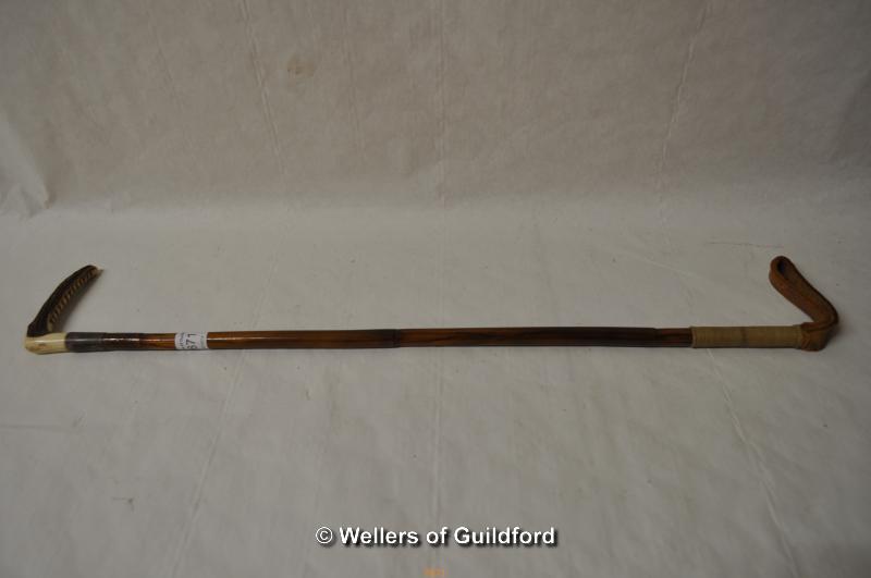 *An early 20th Century bamboo riding crop with antler handle, the silver collar hallmarked