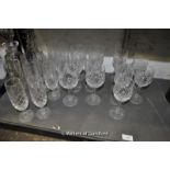 Cut glass ware including ten champagne flutes and six each of red wine and white wine goblets; two