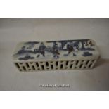 A Chinese blue and white rectangular paperweight with pierced decoration, 15cm long.