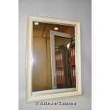 A cream framed modern mirror, 86 x 60.5cm overall.