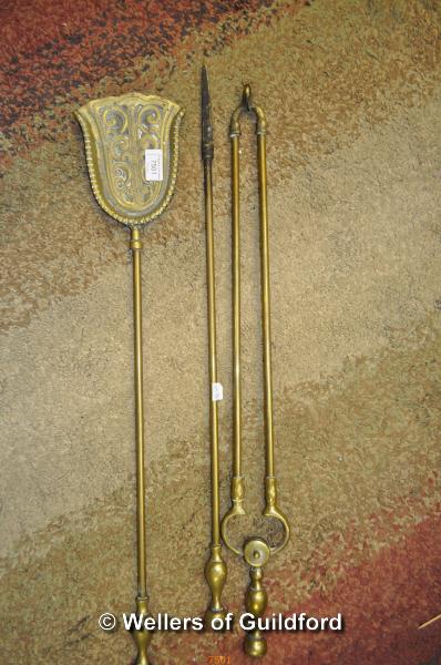 A set of three cast brass fire irons.