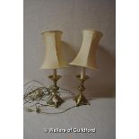 A pair of Arts & Crafts style cast brass table lamps with shades, 56cm to top of shades.