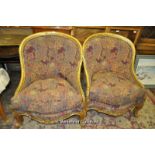 A pair of French style armchairs with gilt showframes, serpentine front setas, dwarf cabriole legs.