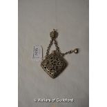 A Chinese white metal pendant smelling salts holder.