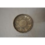 A Chinese white metal dish with coin inset to centre, 9.75cm.