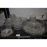 A cut glass twelve place dessert set comprising two serving dishes with stands, twelve small