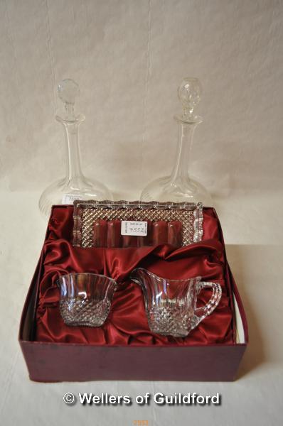 A pair of cut glass globular decanters; a boxed set of Edina crystal - tray, jug and sugar bowl.