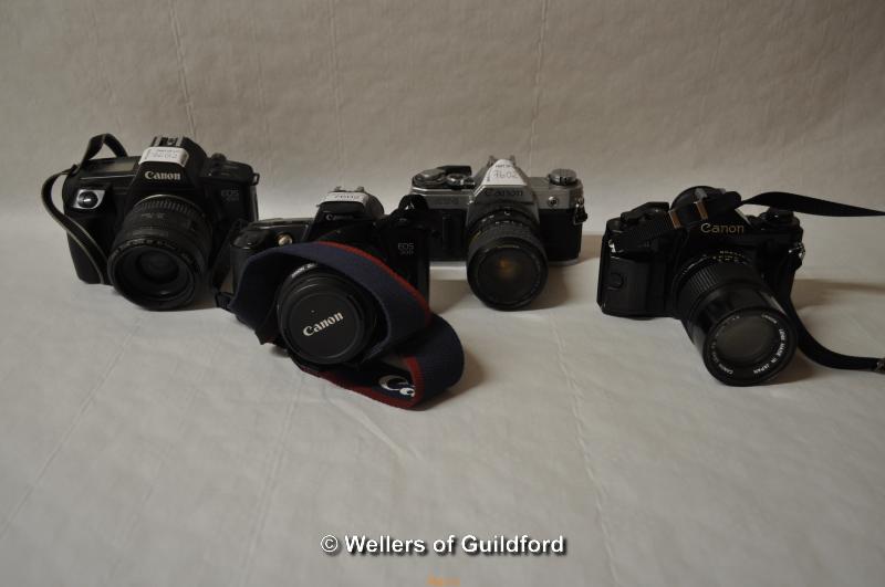 Four Canon cameras with lenses. Camera bodies include: EOS 650 (1105477); EOS 500 (1309150); AT-1 ( - Image 2 of 2