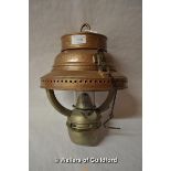 A copper hanging oil lamp.