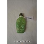 A Chinese green glass scent bottle decorated with koi in a pond.