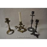 A brass chamberstick cast as a dragon; three further candlesticks (4).