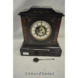 *A Victorian black slate and red marble mantel clock with visible Brocot escapement.