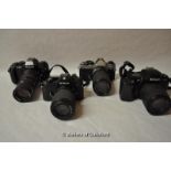 Four Nikon cameras with lenses. Camera bodies include: F-301; FE 4090184; F-601 (2531249); and EM (