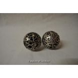 A pair of Chinese white metal pierced silver balls with dragon and phoenix decoration, approx 5cm