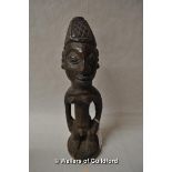 An African carved wooden tribal figure, 25.5cm.