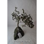An ornamental tree with green hardstone leaves and malachite base, 25cms tall.