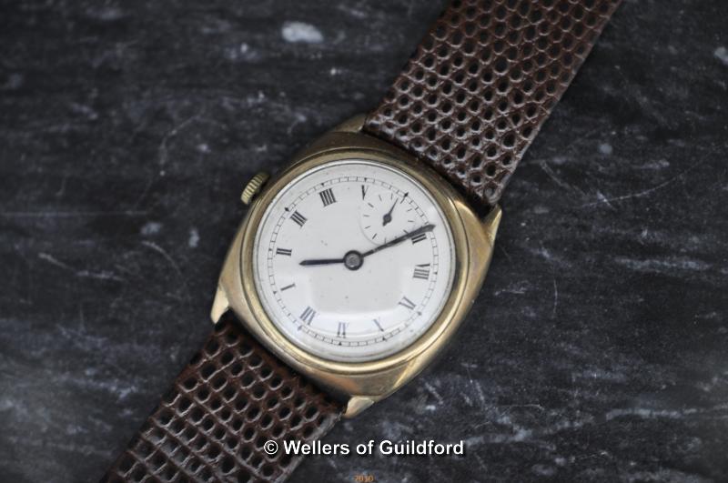 A gentleman's vintage watch with Roman numerals and leather strap.