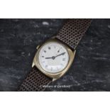 A gentleman's vintage watch with Roman numerals and leather strap.