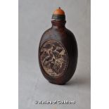 A Chinese horn snuff bottle carved with cranes, cabochon stopper.