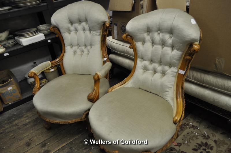 A Victorian gentleman's walnut framed spoonback chair and matching lady's chair.