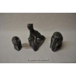 Three Inuit eskimo carvings; one of a bear catching a seal, 10.5cm, an otter eating a fish, 9cm,