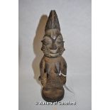 An African carved wooden fertility figure, 23cm.