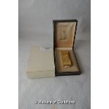 A Dunhill gold plated cigarette lighter in original box with slipcase.
