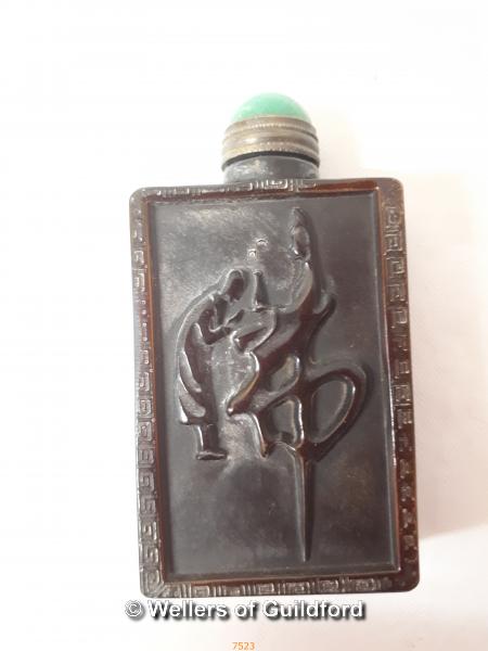 A rectangular horn snuff bottle carved with bamboo.