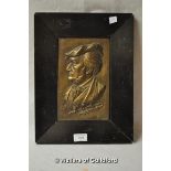 A bronze relief plaque of Richard Wagner looking to left, framed, 37 x 28cm overall.