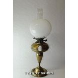A brass oil lamp milk opaque glass shade, 64cm including chimney.