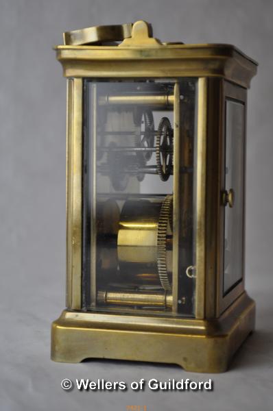 A brass carriage clock, the white enamel dial with Roman numerals, 11cm. - Image 2 of 4