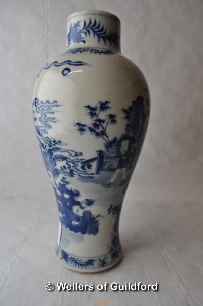 A Chinese blue and white baluster vase decorated with figures in a garden, 19cm.