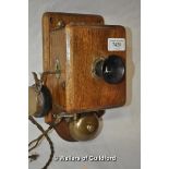 An Edwardian oak wall mounted internal phone.