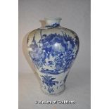 A Chinese blue and white baluster vase decorated with warriors, two rings to base, 33cm.