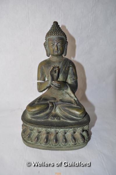 A Chinese iron figure of Buddha, 20cm.