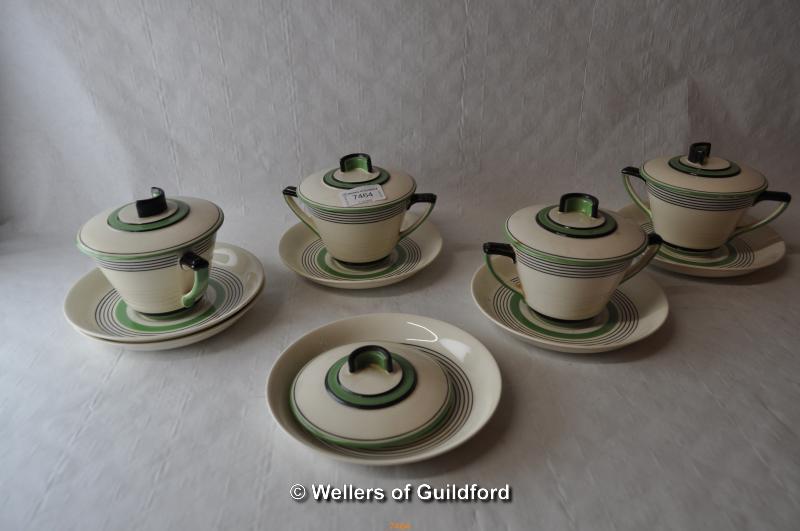 Royal Doulton Radiance pattern: a set of four Art Deco cups and covers with separate stands,