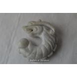 A pale green hardstone figure of a dragon, 5cm.