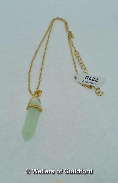 Jade pendant on golden chain