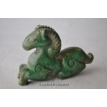 A green jade carving of a recumbent horse, 7cm.