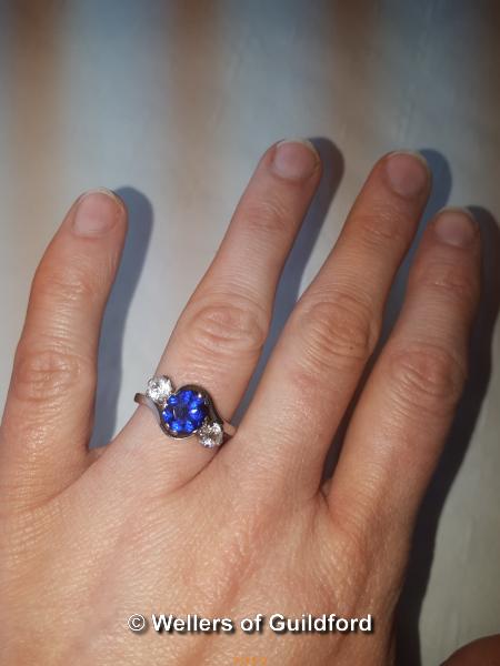 Blue stone ring flanked by cubic zircona, 18ct setting. - Image 2 of 2