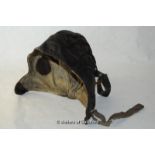 A vintage leather flying hat.