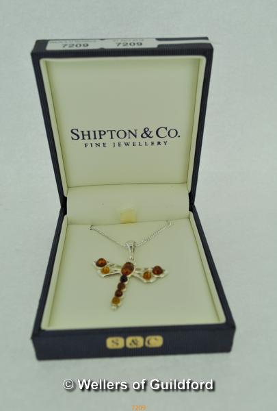 Amber butterfly necklace, on silver chain