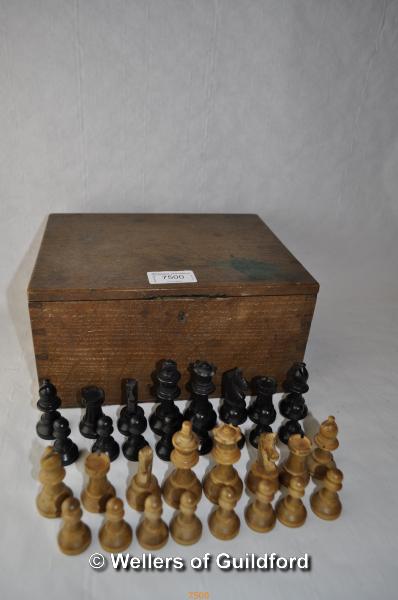 An ebonised and boxwood Staunton pattern chess set, height of king 6.5cm; an old oak box.