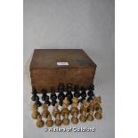An ebonised and boxwood Staunton pattern chess set, height of king 6.5cm; an old oak box.
