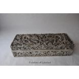 A Chinese white metal rectangular box and cover decorated all over with dragons, 19.5cm long.