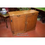 EDWARDIAN OAK SERVING CUPBOARD WITH PULL OUT SLIDE OVER PAIR OF CUPBOARD DOORS ENCLOSING SHELVES,