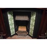 DECORATIVE CAST IRON FIRE INSERT WITH GREEN TILES